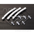 Wooden white kids clothes hanger and children hanger with metal clips for pants
